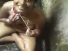 Chubby Indian floozy soaping her body in outdoor shower